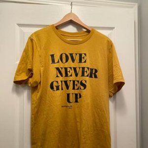 Beacon Threads Love Never Gives Up T-Shirt